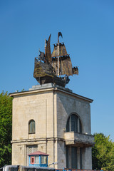 Russia, Moscow region, August 2108. Bronze sailboat model on the roof of the gateway building on...