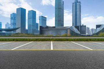 empty car park with downtown city space background