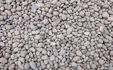 white and gray stone pebbles texture, gravel material background pattern. 