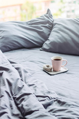 grey bed sunlight sunday. pillow blanket. cup background