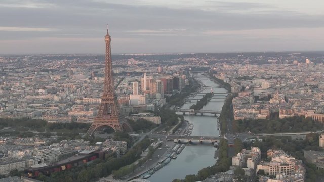 Aerial drone shot of the famous Eiffel Tower in Paris, France on a cloudy day