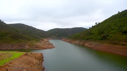 Aerial. Flying drone in fog and clouds over the hills in Monchique Portugal.