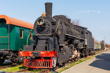 Fototapeta premium Stary pociąg retro vintage. Historyczny transport kolejowy.
