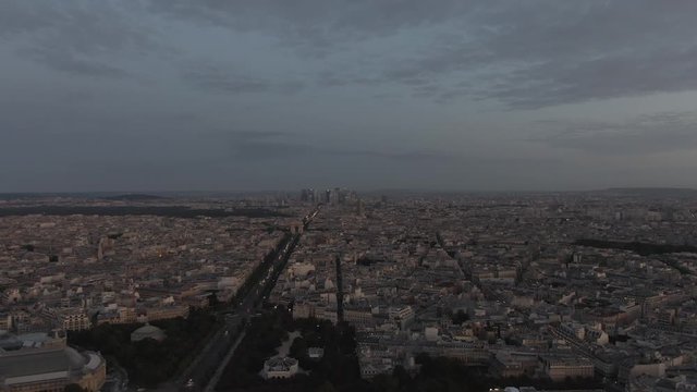 Aerial Drone Shot of the Cityscape of Paris, France with the Skyscrapers of La Defense seen in the back