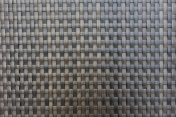 Black rattan pattern background.