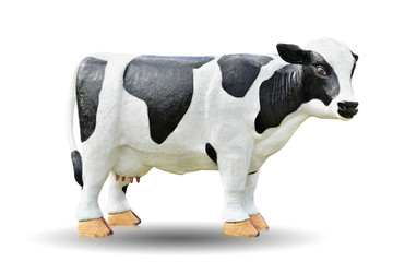 Black and white cow cement doll isolated on white background. This has clipping path. 