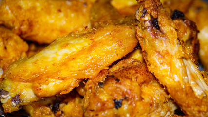 Fried chicken wings. Selected focus. Close up.