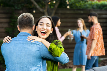 Happy young girl hugging a friend