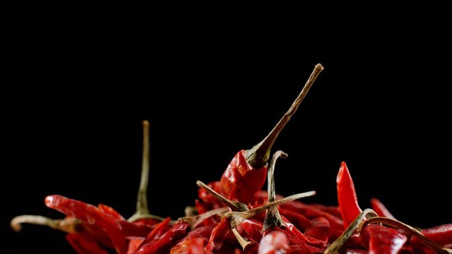 Close up shot of dried red chilies (Lal Mirch - Indian Masala) rotating . 