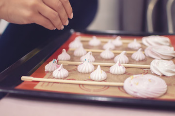 the girl's hands prepare the meringue at home. confectionery. selective focus