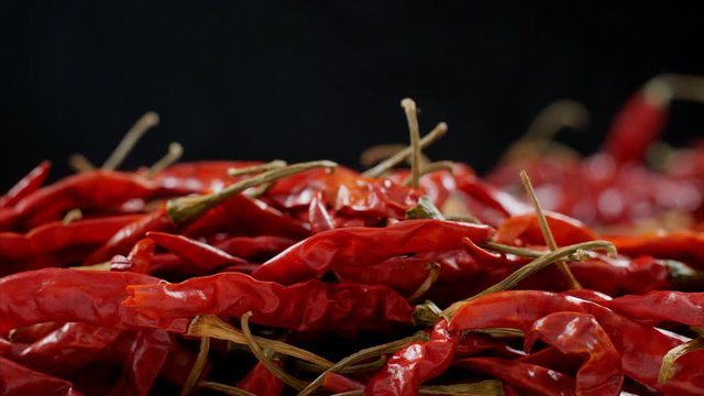 Pan shot of red chilies heap - Lal Mirch (Hot Indian Spice). 