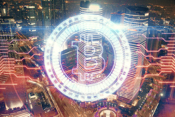 Multi exposure of cryptocurrency theme hologram drawing and city veiw background. Concept of...