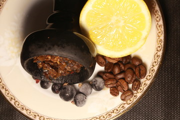 bowl with tobacco for hookah. berries on a black background
