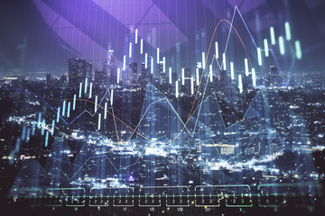 Financial graph on night city scape with tall buildings background multi exposure. Analysis concept.