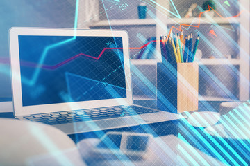 Financial chart drawing and table with computer on background. Multi exposure. Concept of...