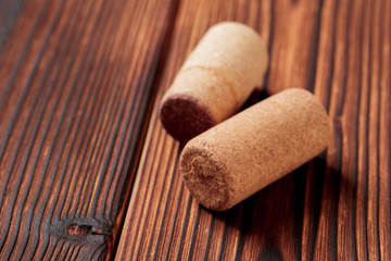 wine corks on a dark wooden background texture with a place for text.  - Image