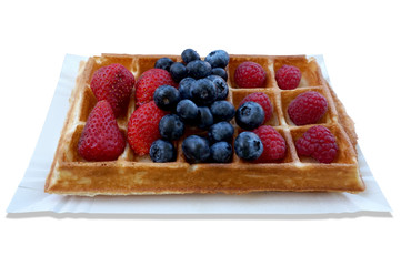 Waffle with fruits - strawberries, blueberries and raspberries