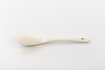 Spoon of fine granulated sugar isolated on white  - Image