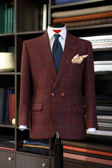 Mannequin with bespoke checkered jacket in atelier