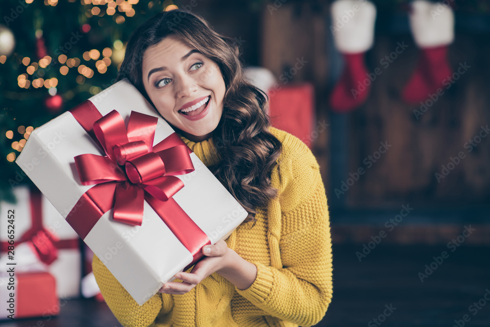 Sticker Close up photo of cute nice charming beautiful attractive girlfriend listening to what is inside box wearing jeans denim yellow pullover