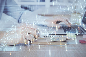 Multi exposure of financial graph with man works in office on background. Concept of analysis.