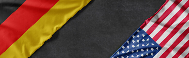 Obraz premium Flags of Germany and the United States of America with copy space