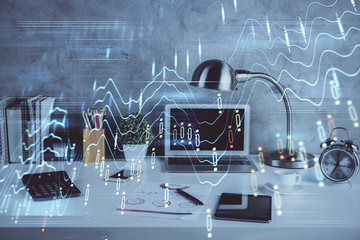 Double exposure of graph and financial info and work space with computer background. Concept of international online trading.