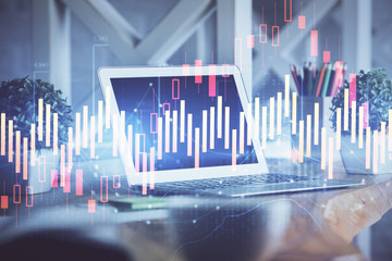 Stock market graph and table with computer background. Multi exposure. Concept of financial analysis.