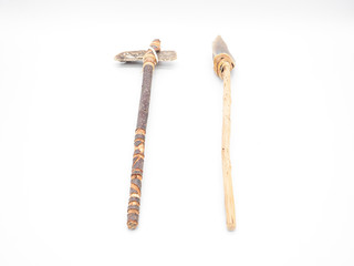 Replicas of the primal stone tools with wooden handles and leather strapping isolated on white...