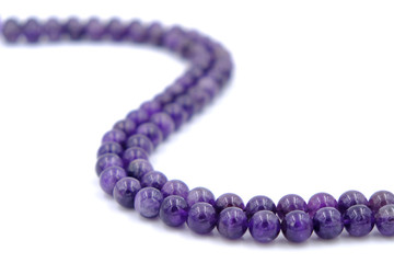 Purple amethyst natural stone round shape bead isolated on white background