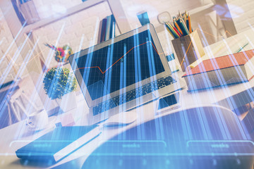 Multi exposure of graph and financial info and work space with computer background. Concept of...