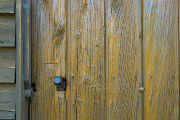 Nice wooden door with nails background.