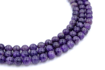Purple amethyst natural stone round shape bead isolated on white background