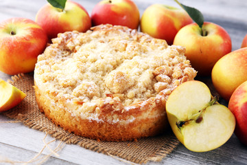 Apple pie or homemade cake with apples on wood. Delicous dessert apple tart