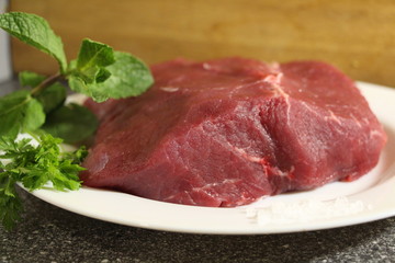 raw meat on a cutting board