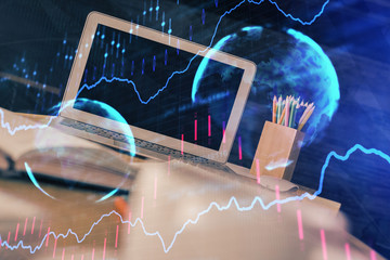 Forex market graph hologram and personal computer on background. Multi exposure. Concept of investment.