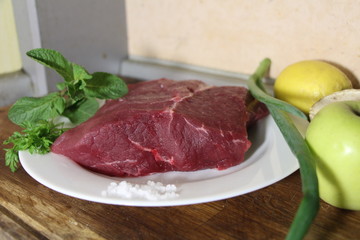 raw meat on a cutting board
