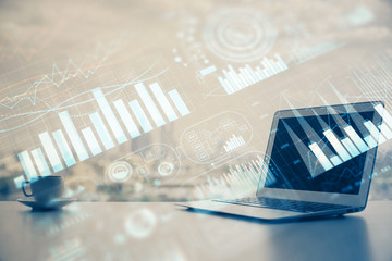 Forex Chart hologram on table with computer background. Double exposure. Concept of financial markets.