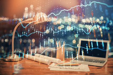 Double exposure of forex chart and work space with computer. Concept of international online trading.