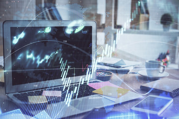 Forex market graph hologram and personal computer on background. Multi exposure. Concept of investment.