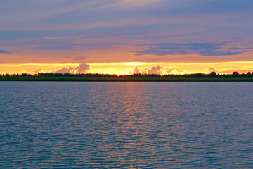 Naklejka premium Summer sunset on Sorozhye Lake. Kostroma region, Russia.