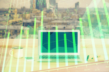 Financial chart drawing and table with computer on background. Multi exposure. Concept of international markets.