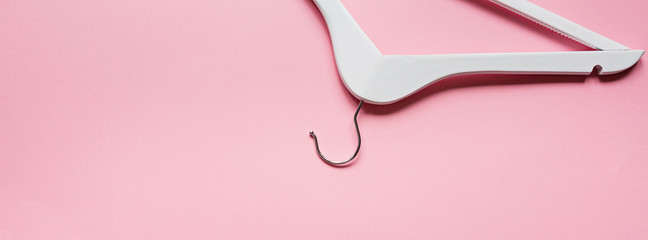 white wooden shoulder on pastel pink background. Fashion feminine blog sale store promo design...