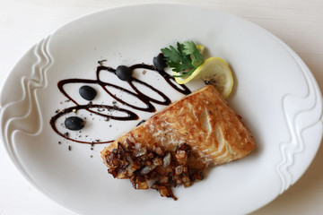 Fried pike perch and onions