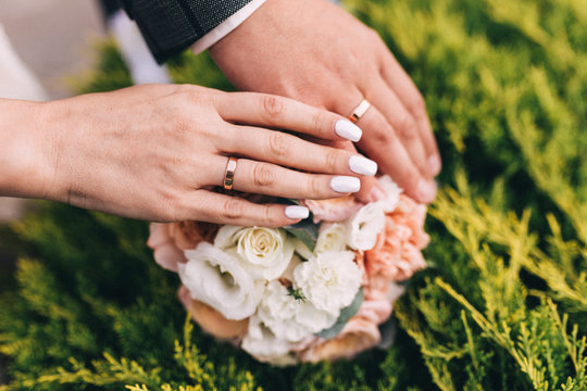 Picture of man and woman with wedding ring. Newly wed couple's hands with wedding rings