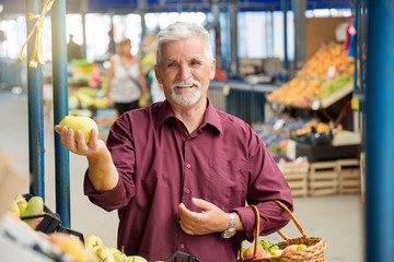 Senior man Buying Fruits on Farmers Market