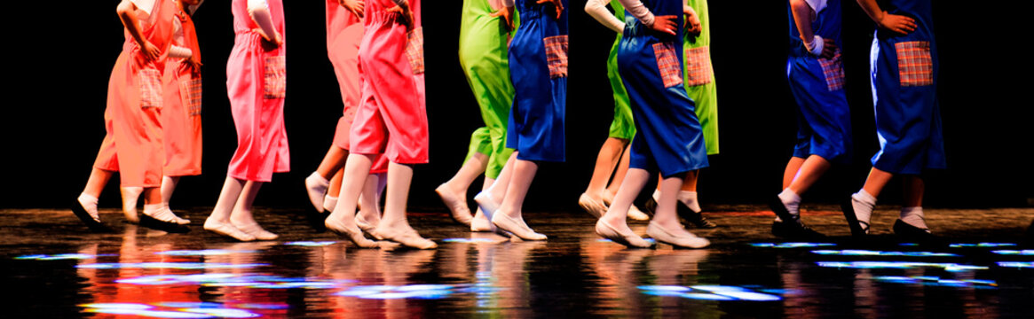 Children run on stage, theatrical performance