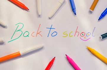 The motive for returning children to school. Felt-tip pens with the words back to school.