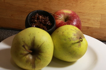 bowl with tobacco for hookah. berries on a black background