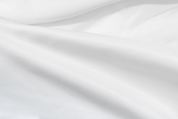 Fototapeta na wymiar Soft focus white silk fabric texture background